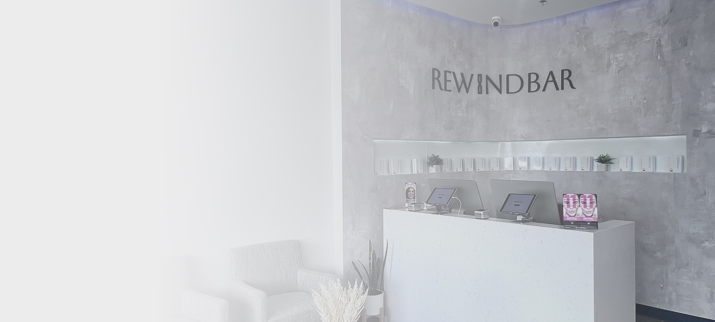 Rewind Bar’s reception desk and blue seating at the South Plainfield clinic